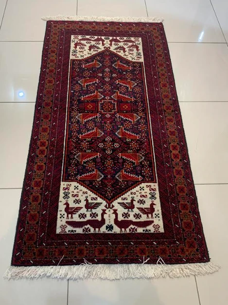 Ruby red Turkoman runner with five diamond medallions