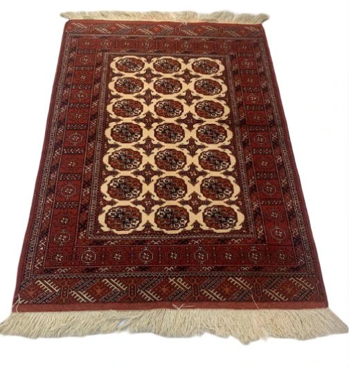 Sienna tribal rug with large central medallion and tribal figures