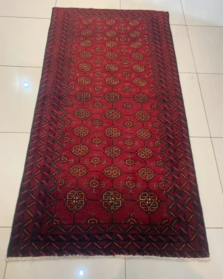 Ivory Turkoman rug with tribal diamond pattern and teal accents
