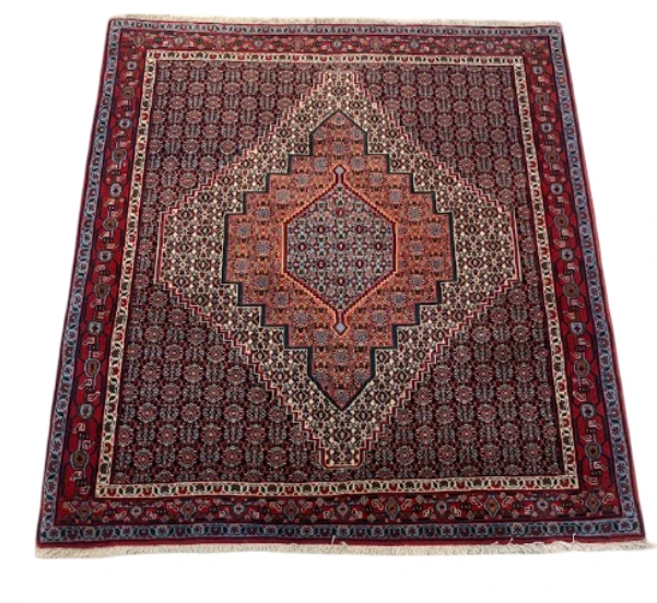Cream Bokhara rug with octagon medallions on ivory field