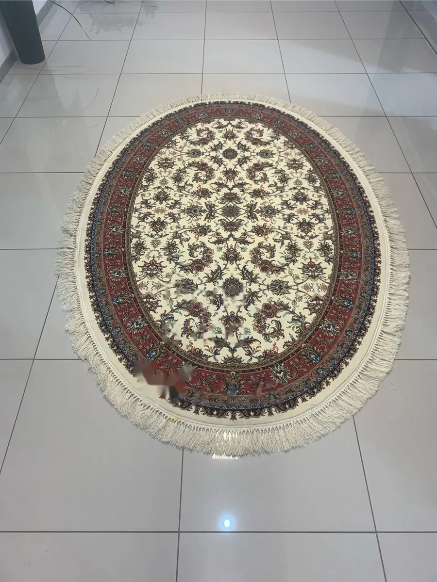 Oval Persian-style rug with cream field and red floral medallion
