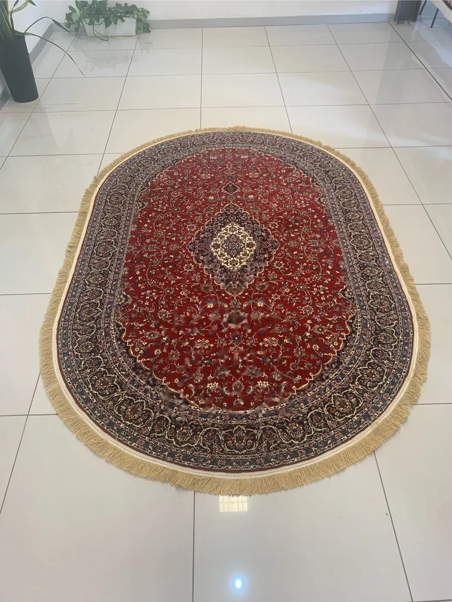 Oval Ja Shan rug with red field and navy floral medallion border