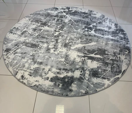 Round grey and white abstract rug