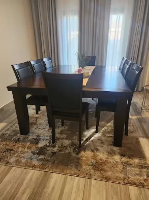 Modern dining set over rug