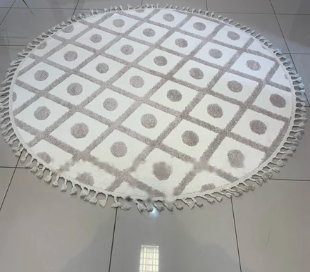 Round taupe dot diamond tasselled rug
