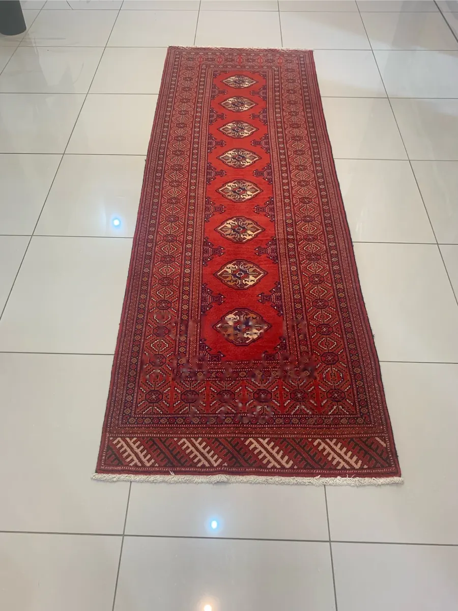 Torkaman handmade runner rug with red Bokhara medallion pattern