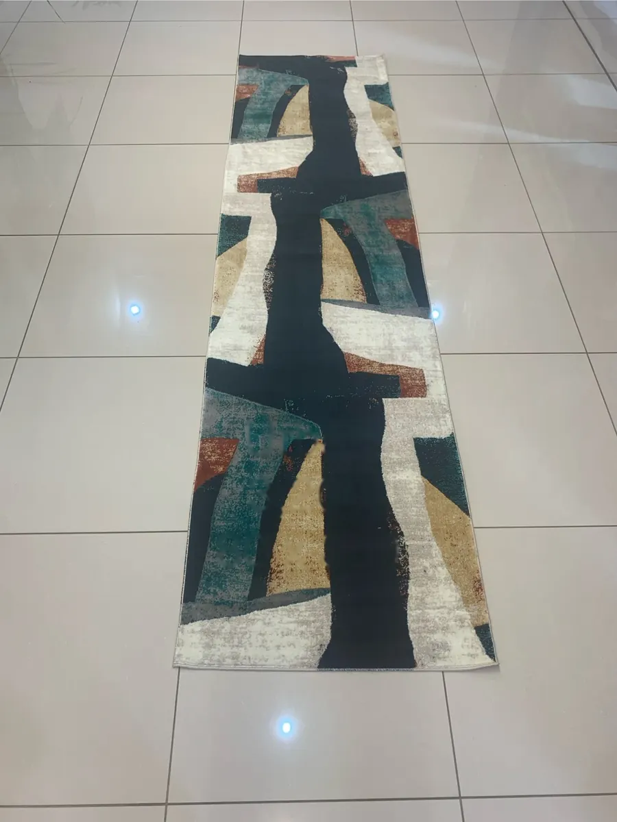 Urban machine-made runner rug with navy angular abstract pattern