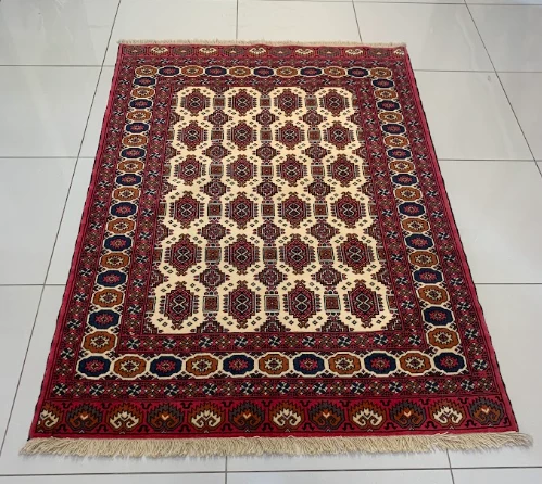 Cherry red Bokhara rug with oval guls in rows