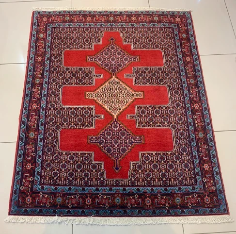 Indigo Senneh style square rug with diamond medallion